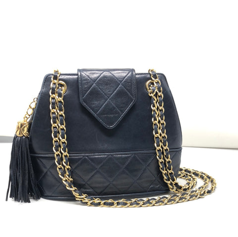 Vintage: Chanel navy lambskin top flab shoulder bag with gold hardware and tassle