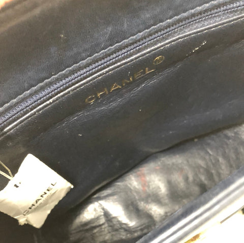 Vintage: Chanel navy lambskin top flab shoulder bag with gold hardware and tassle