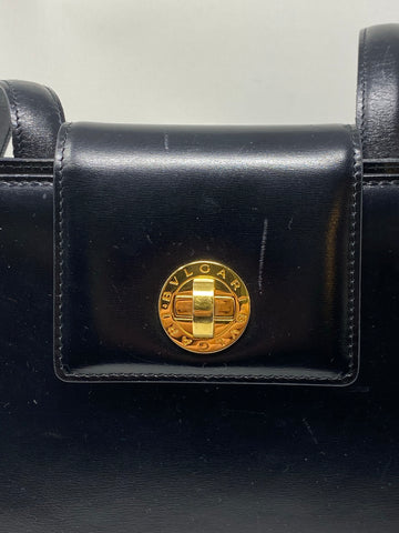 Vintage: BVLGARI black leather single flap Shoulder bag with gold closure and turn lock